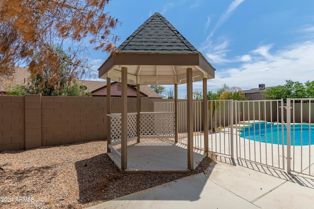 view of pool featuring a gazebo and a patio area