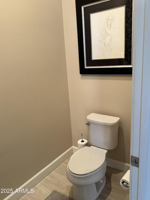 4571 S Pinaleno Dr W, Chandler, AZ 85249 - bathroom featuring wood finished floors, toilet, and baseboards