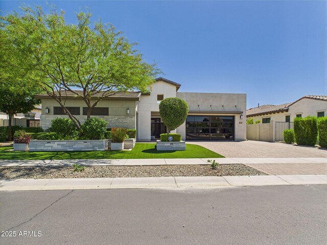 4571 S Pinaleno Dr W, Chandler, AZ 85249 - view of front of home with fence, decorative driveway, stucco siding, and an attached garage