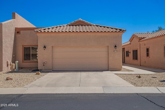 18650 N 91st Ave Unit 3301, Peoria, AZ 85382 - mediterranean / spanish home with an attached garage, concrete driveway, stucco siding, and a tile roof
