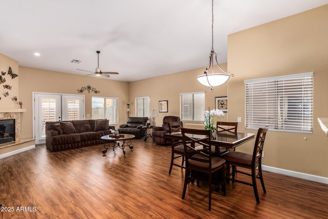 18650 N 91st Ave Unit 3301, Peoria, AZ 85382 - dining space featuring ceiling fan, wood finished floors, a high end fireplace, baseboards, and recessed lighting
