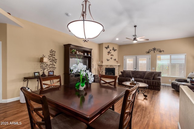 18650 N 91st Ave Unit 3301, Peoria, AZ 85382 - dining space featuring wood finished floors, a ceiling fan, a fireplace, baseboards, and recessed lighting