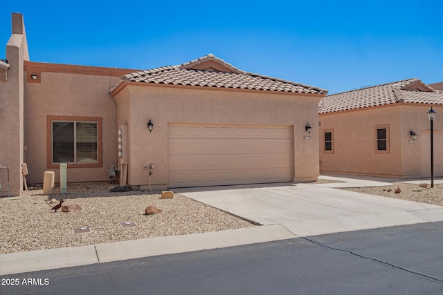 18650 N 91st Ave Unit 3301, Peoria, AZ 85382 - mediterranean / spanish-style home featuring an attached garage, stucco siding, driveway, and a tiled roof