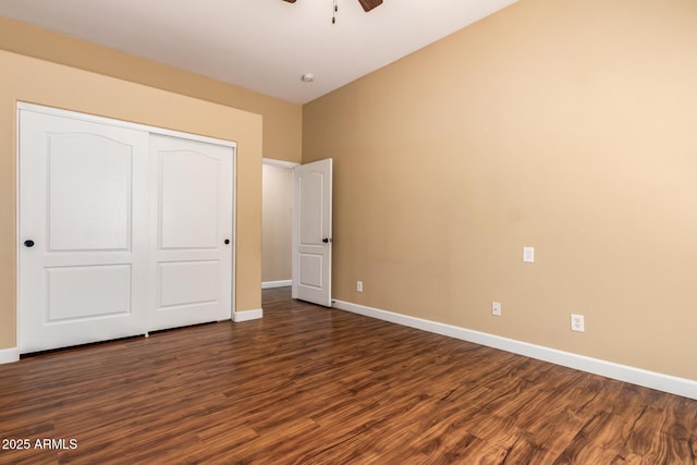 18650 N 91st Ave Unit 3301, Peoria, AZ 85382 - unfurnished bedroom featuring dark wood-style flooring, baseboards, a closet, and ceiling fan