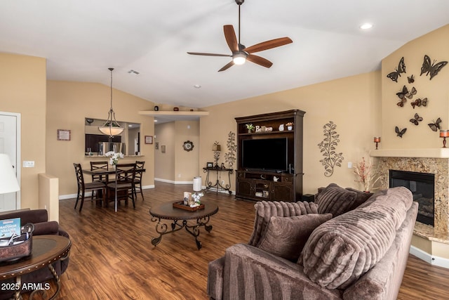 18650 N 91st Ave Unit 3301, Peoria, AZ 85382 - living area with vaulted ceiling, ceiling fan, wood finished floors, a fireplace, and baseboards