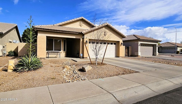 view of front of house with a tile roof, stucco siding, a porch, a garage, and driveway