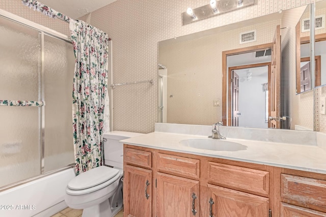full bath with wallpapered walls, shower / bath combination with glass door, toilet, and vanity