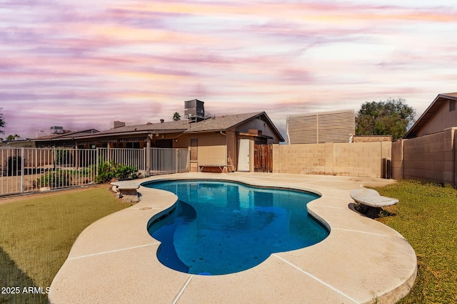 view of pool with a fenced backyard and a patio