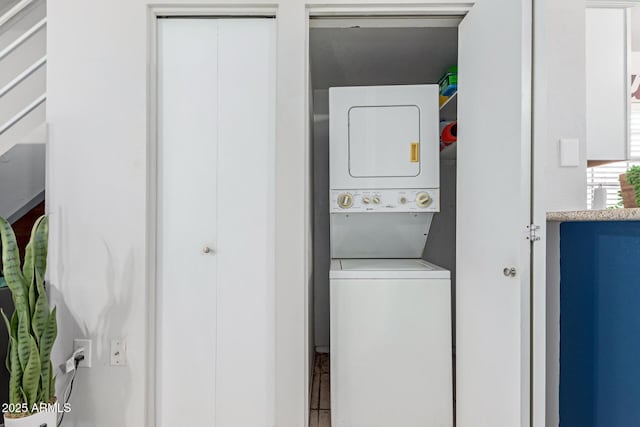 laundry area with laundry area and stacked washing maching and dryer