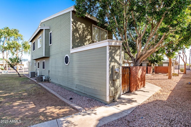 view of home's exterior featuring fence