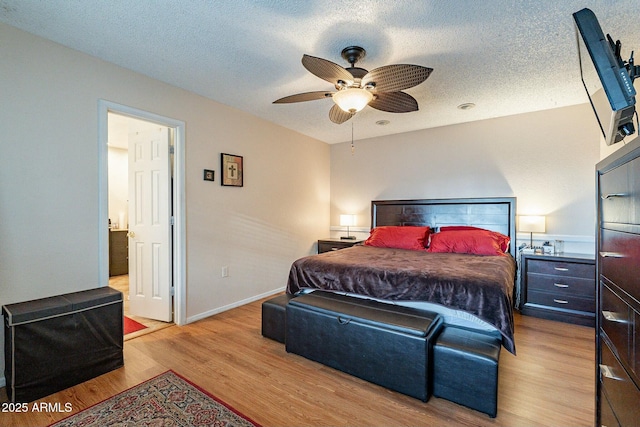 bedroom with baseboards, a textured ceiling, wood finished floors, and a ceiling fan