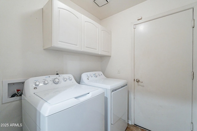 laundry area with cabinet space and independent washer and dryer