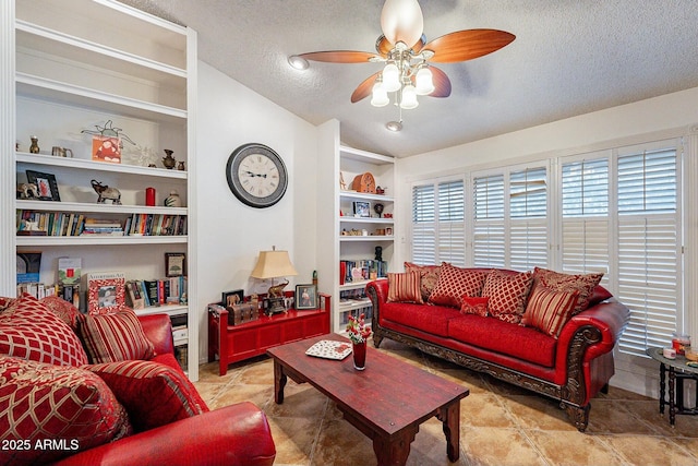 living room featuring built in features, a textured ceiling, and a ceiling fan