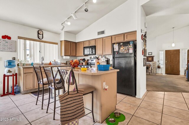 871 N Granada Dr, Chandler, AZ 85226 - kitchen featuring black appliances, track lighting, light tile patterned flooring, high vaulted ceiling, and a kitchen breakfast bar