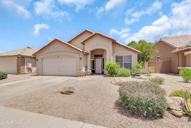 871 N Granada Dr, Chandler, AZ 85226 - mediterranean / spanish house featuring stucco siding, a garage, concrete driveway, and a tiled roof