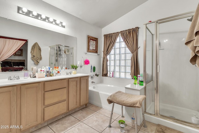 871 N Granada Dr, Chandler, AZ 85226 - full bathroom with vaulted ceiling, a shower stall, tile patterned floors, a garden tub, and double vanity