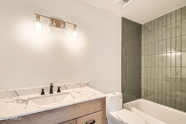 bathroom featuring toilet, vanity, and  shower combination