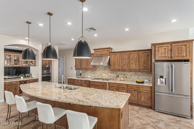 kitchen featuring pendant lighting, a spacious island, and appliances with stainless steel finishes