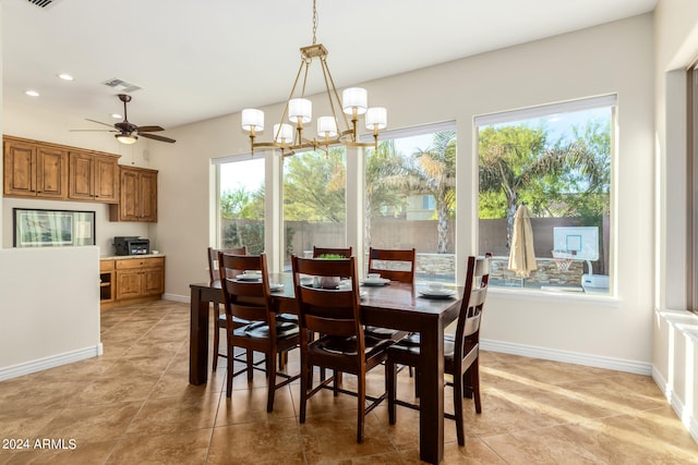 dining area with ceiling fan with notable chandelier