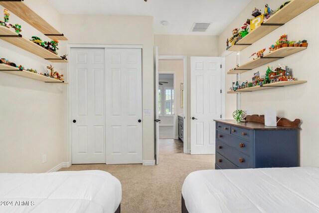 carpeted bedroom with a closet