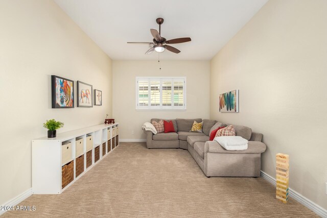 carpeted living room featuring ceiling fan