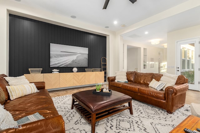 tiled living room featuring ceiling fan