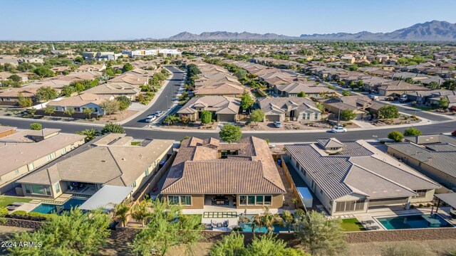 birds eye view of property featuring a mountain view