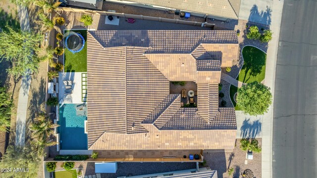 mediterranean / spanish home featuring a garage and a front yard