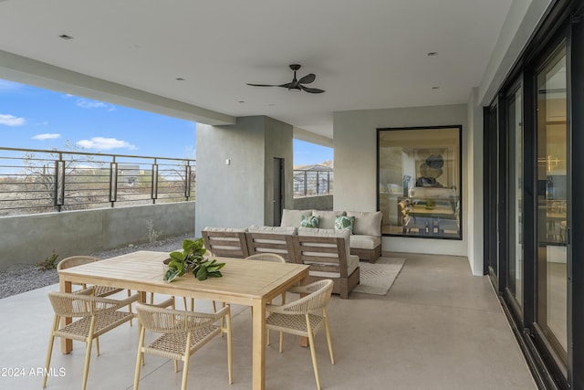 view of patio with ceiling fan and an outdoor living space