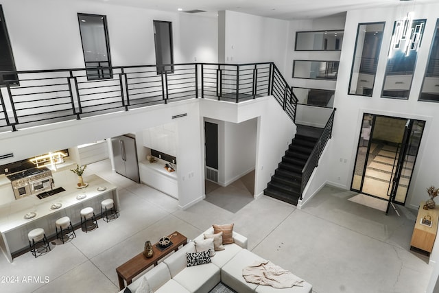 living room with a towering ceiling