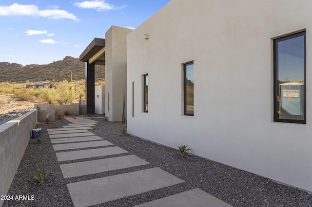 view of property exterior featuring a mountain view