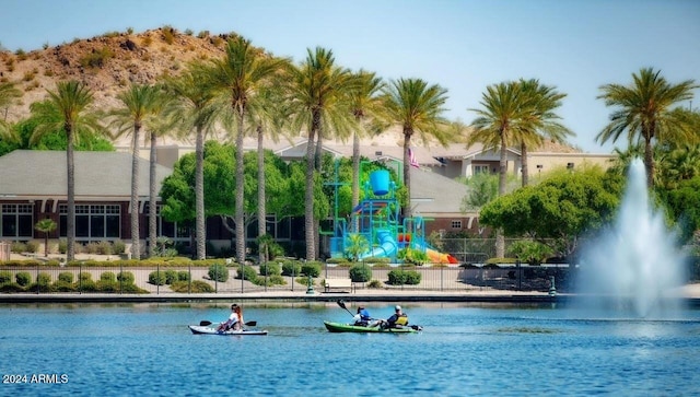 view of pool featuring a water view