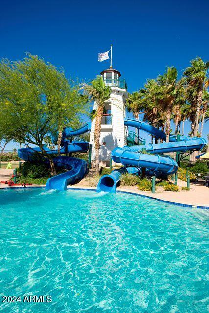 view of pool with a water slide