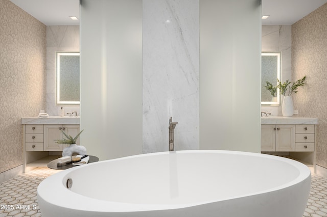 bathroom featuring vanity and a tub