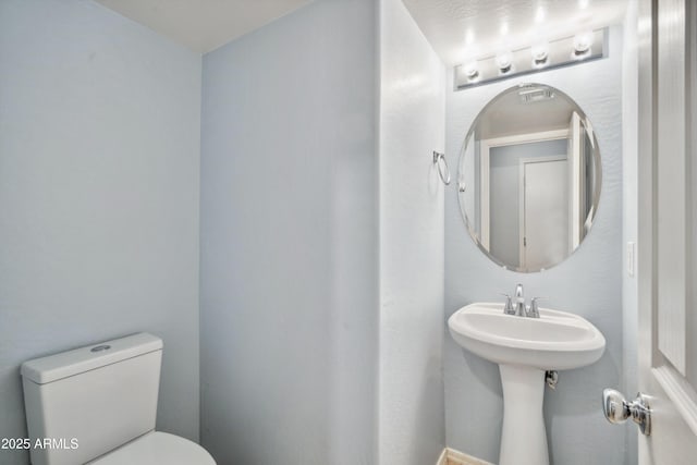 bathroom featuring toilet