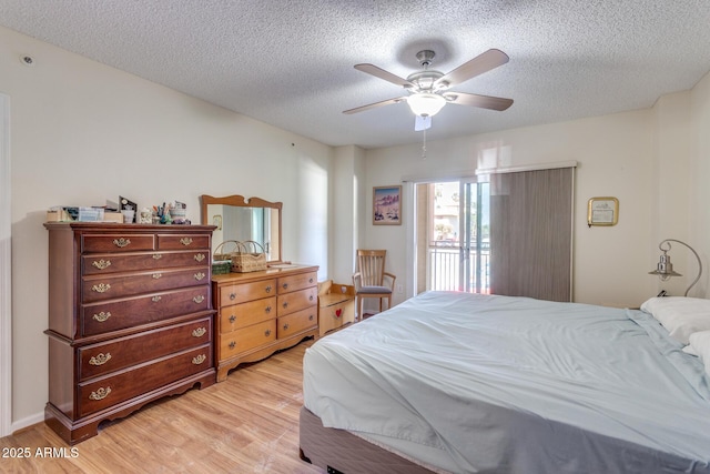 bedroom featuring a ceiling fan, a textured ceiling, access to exterior, and light wood finished floors