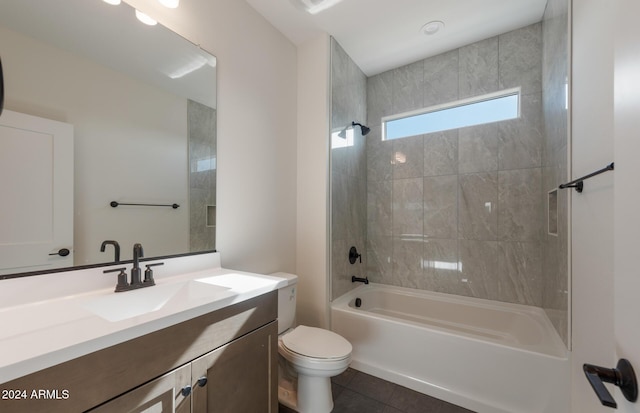 full bathroom featuring tile patterned floors, vanity, toilet, and tiled shower / bath