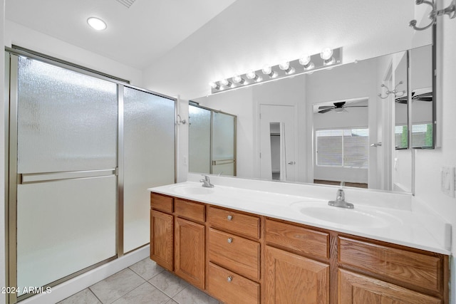 bathroom with walk in shower, vanity, tile patterned floors, and ceiling fan