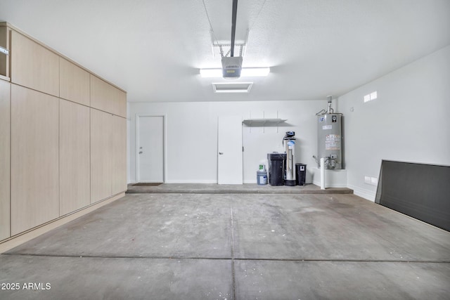 garage with a garage door opener and gas water heater