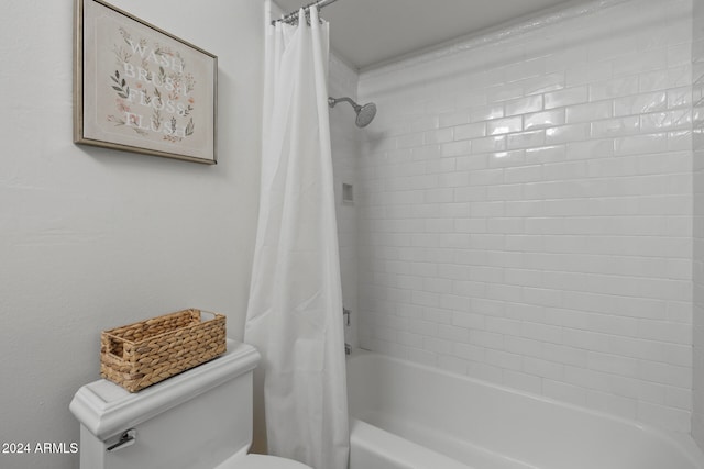 bathroom with toilet and shower / bath combo