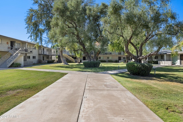 view of community featuring a yard