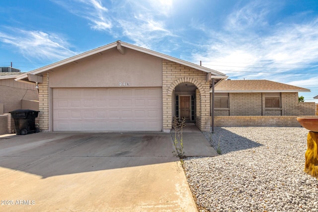 940 S Revere, Mesa, AZ 85210 - ranch-style house with brick siding, concrete driveway, and an attached garage