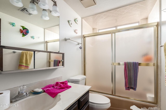 940 S Revere, Mesa, AZ 85210 - bathroom with toilet, vanity, and shower / bath combination with glass door