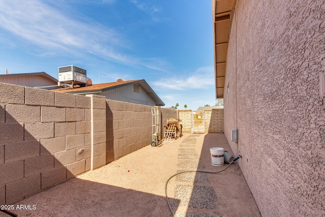 940 S Revere, Mesa, AZ 85210 - view of side of property with central air condition unit, a fenced backyard, and stucco siding