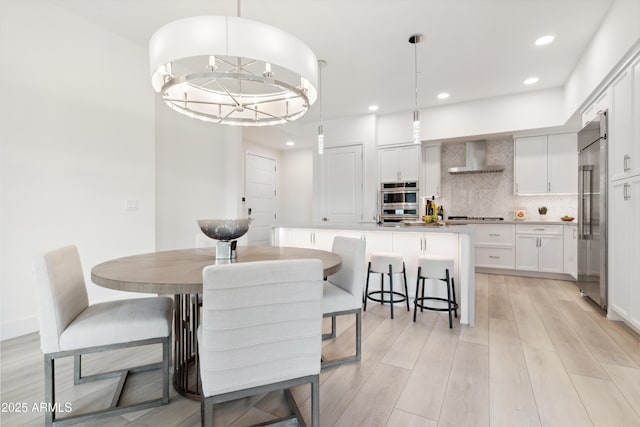 5250 E Deer Valley Dr Unit 140, Phoenix, AZ 85054 - dining area featuring light wood-style floors and recessed lighting