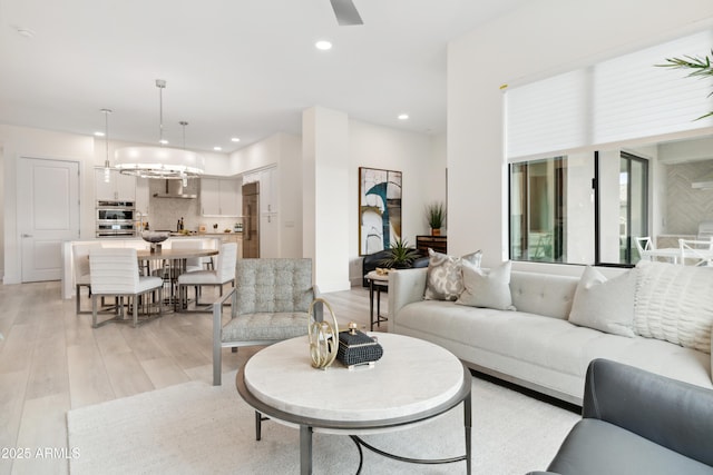 5250 E Deer Valley Dr Unit 140, Phoenix, AZ 85054 - living area with light wood-style floors, recessed lighting, and a ceiling fan