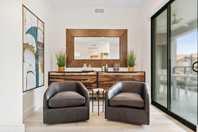 5250 E Deer Valley Dr Unit 140, Phoenix, AZ 85054 - sitting room featuring wood finished floors and baseboards
