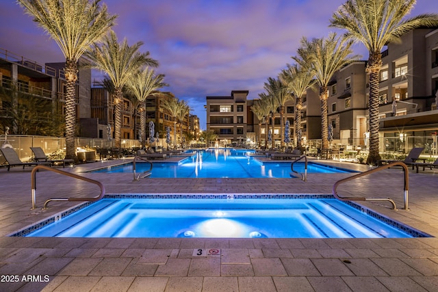 5250 E Deer Valley Dr Unit 140, Phoenix, AZ 85054 - pool at dusk with a community pool and a patio area