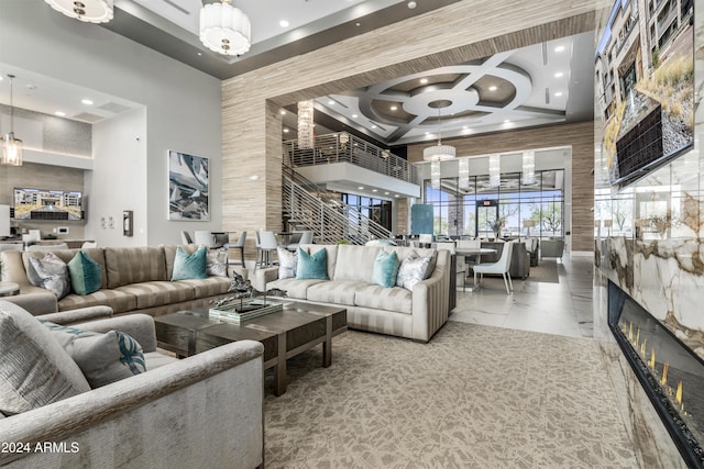 5250 E Deer Valley Dr Unit 140, Phoenix, AZ 85054 - living room with a towering ceiling, coffered ceiling, recessed lighting, a large fireplace, and marble finish floors