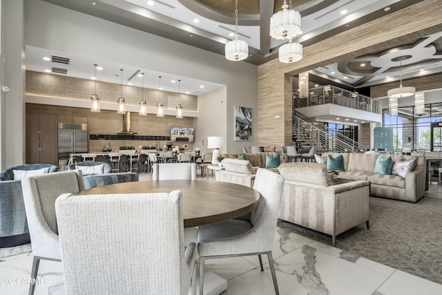 5250 E Deer Valley Dr Unit 140, Phoenix, AZ 85054 - dining room with a towering ceiling, recessed lighting, light marble finish flooring, and coffered ceiling